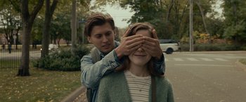 Movie still from “The Silence” (2019), directed by John R. Leonetti – A man covering a woman's eyes with her hands; Close Up shot, Over the shoulder angle