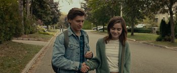 Movie still from “The Silence” (2019), directed by John R. Leonetti – A man and a woman walking down a street; Medium shot, Over the shoulder angle