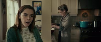 Movie still from “The Silence” (2019), directed by John R. Leonetti – A woman standing next to a woman cooking in a kitchen; Close Up shot, Over the shoulder angle