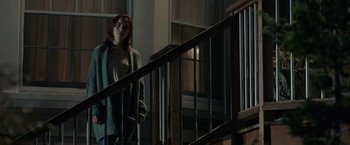 Movie still from “The Silence” (2019), directed by John R. Leonetti – A woman standing at the bottom of a staircase; Medium shot, Low angle
