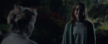 Movie still from “The Silence” (2019), directed by John R. Leonetti – A woman standing next to a man in front of trees; Medium shot, Over the shoulder angle