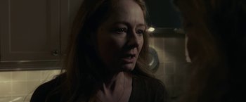 Movie still from “The Silence” (2019), directed by John R. Leonetti – A person with long brown hair; Close Up shot, Over the shoulder angle