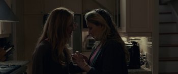 Movie still from “The Silence” (2019), directed by John R. Leonetti – Two women standing next to each other in a kitchen; Close Up shot, Over the shoulder angle