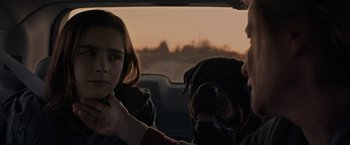 Movie still from “The Silence” (2019), directed by John R. Leonetti – A woman and a dog in the back of a car; Close Up shot, Over the shoulder angle