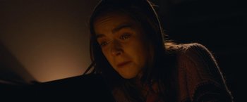 Movie still from “The Silence” (2019), directed by John R. Leonetti – A woman looking at the camera in the dark; Close Up shot, High angle