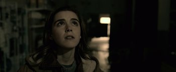 Movie still from “The Silence” (2019), directed by John R. Leonetti – A young woman looking up at the sky; Close Up shot, Low angle