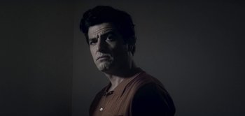 Movie still from “The Spy” (2019), directed by Gideon Raff – A person wearing a brown shirt; Close Up shot, Low angle