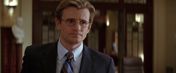A person wearing a suit and tie