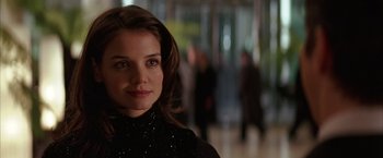 Movie still from “Batman Begins” (2005), directed by Christopher Nolan – A person wearing a black shirt; Close Up shot, Over the shoulder angle