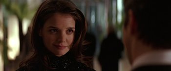 Movie still from “Batman Begins” (2005), directed by Christopher Nolan – A person wearing a black shirt; Close Up shot, Over the shoulder angle