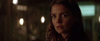 Movie still from “Batman Begins” (2005), directed by Christopher Nolan – A person looking at the camera; Close Up shot, Over the shoulder angle