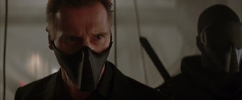 Movie still from “Batman Begins” (2005), directed by Christopher Nolan – A person wearing a mask; Close Up shot, Low angle