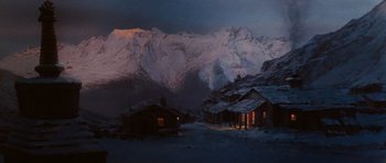 Movie still from “Raiders of the Lost Ark” (1981), directed by Steven Spielberg – A snowy mountain with a bunch of buildings in the background; Extreme Wide shot, High angle