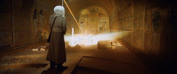 Movie still from “Raiders of the Lost Ark” (1981), directed by Steven Spielberg – A man standing in front of an egyptian temple; Extreme Wide shot, Low angle
