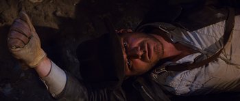 Movie still from “Raiders of the Lost Ark” (1981), directed by Steven Spielberg – A person wearing a hat; Close Up shot, Overhead angle