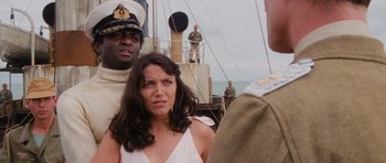 Movie still from “Raiders of the Lost Ark” (1981), directed by Steven Spielberg – A woman standing next to a man on a boat; Medium shot, Over the shoulder angle