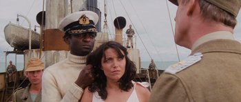 Movie still from “Raiders of the Lost Ark” (1981), directed by Steven Spielberg – A man and a woman standing on a boat in the water; Medium shot, Low angle