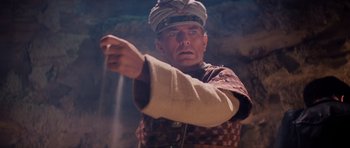 Movie still from “Raiders of the Lost Ark” (1981), directed by Steven Spielberg – A man in a military uniform points to the side; Close Up shot, Low angle