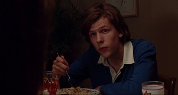Movie still from “The Squid and the Whale” (2005), directed by Noah Baumbach – A man sitting in front of a plate of food; Close Up shot, Over the shoulder angle