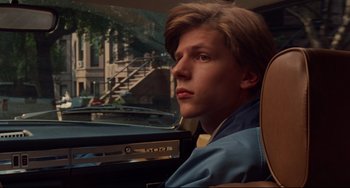 Movie still from “The Squid and the Whale” (2005), directed by Noah Baumbach – A man sitting in the driver's seat of a car; Close Up shot, Over the shoulder angle