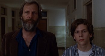 Movie still from “The Squid and the Whale” (2005), directed by Noah Baumbach – A man and a boy standing next to each other in a room; Close Up shot, Low angle