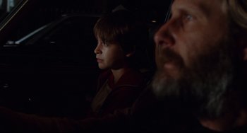 Movie still from “The Squid and the Whale” (2005), directed by Noah Baumbach – A man and a boy sitting in the back of a car; Close Up shot, Over the shoulder angle