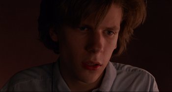 Movie still from “The Squid and the Whale” (2005), directed by Noah Baumbach – A young man with long brown hair stares into the camera; Close Up shot, Low angle