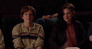 Movie still from “The Squid and the Whale” (2005), directed by Noah Baumbach – A man and a woman sitting next to each other on a couch; Medium shot, High angle