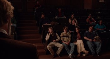 Movie still from “The Squid and the Whale” (2005), directed by Noah Baumbach – A group of people sitting in a theater; Wide shot, High angle