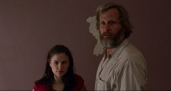Movie still from “The Squid and the Whale” (2005), directed by Noah Baumbach – A man and a woman standing next to each other in a room; Medium shot, Over the shoulder angle
