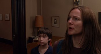 Movie still from “The Squid and the Whale” (2005), directed by Noah Baumbach – A woman and a boy in a living room; Close Up shot, Over the shoulder angle