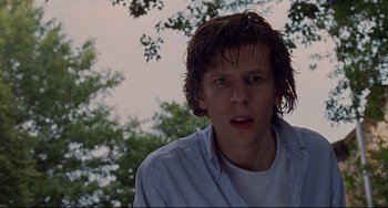 Movie still from “The Squid and the Whale” (2005), directed by Noah Baumbach – A young man with wet hair is looking at the camera; Close Up shot, Low angle