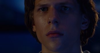 Movie still from “The Squid and the Whale” (2005), directed by Noah Baumbach – A young man's face in the dark; Close Up shot, Over the shoulder angle