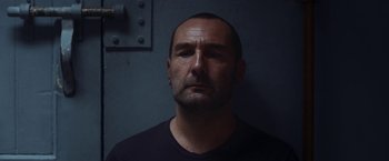 A person wearing a black t - shirt