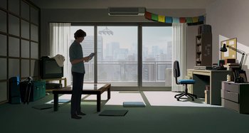 Movie still from “The Summit of the Gods” (2021), directed by Patrick Imbert – A person standing in a room with a laptop; Extreme Wide shot, High angle