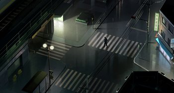 Movie still from “The Summit of the Gods” (2021), directed by Patrick Imbert – A man walking across a crosswalk at night; Extreme Wide shot, High angle