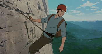 Movie still from “The Summit of the Gods” (2021), directed by Patrick Imbert – An illustration of a man climbing a rock wall; Medium shot, Low angle