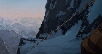 Movie still from “The Summit of the Gods” (2021), directed by Patrick Imbert – A ski slope with a mountain in the background; Extreme Wide shot, Low angle