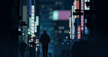 Movie still from “The Summit of the Gods” (2021), directed by Patrick Imbert – A man standing in the middle of a city at night; Extreme Wide shot, Low angle