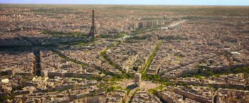 Movie still from “The Takedown” (2022), directed by Louis Leterrier – An aerial view of a large city with many buildings; Extreme Wide shot, High angle