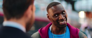 Movie still from “The Takedown” (2022), directed by Louis Leterrier – A person talking to another person; Close Up shot, Over the shoulder angle