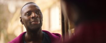 Movie still from “The Takedown” (2022), directed by Louis Leterrier – A person wearing a hoodie; Close Up shot, Over the shoulder angle