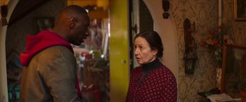 Movie still from “The Takedown” (2022), directed by Louis Leterrier – A man and a woman talking to each other; Medium shot, Over the shoulder angle