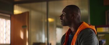 Movie still from “The Takedown” (2022), directed by Louis Leterrier – A person wearing a jacket; Close Up shot, Low angle