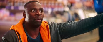 Movie still from “The Takedown” (2022), directed by Louis Leterrier – A person looking up at something; Close Up shot, Over the shoulder angle
