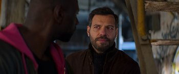 Movie still from “The Takedown” (2022), directed by Louis Leterrier – Close Up shot, Over the shoulder angle