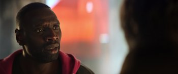 Movie still from “The Takedown” (2022), directed by Louis Leterrier – A person talking to another person; Close Up shot, Over the shoulder angle