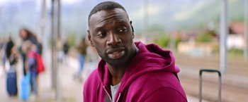 Movie still from “The Takedown” (2022), directed by Louis Leterrier – A person wearing a hooded sweatshirt; Close Up shot, Over the shoulder angle