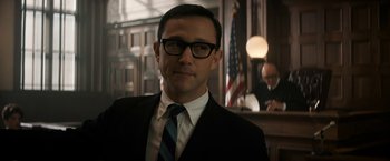 Movie still from “The Trial of the Chicago 7” (2020), directed by Aaron Sorkin – A man in a suit and tie in a courtroom; Close Up shot, Low angle