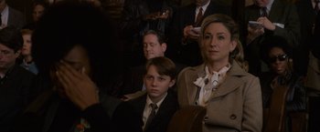Movie still from “The Trial of the Chicago 7” (2020), directed by Aaron Sorkin – A group of people sitting next to each other in a room; Close Up shot, Over the shoulder angle